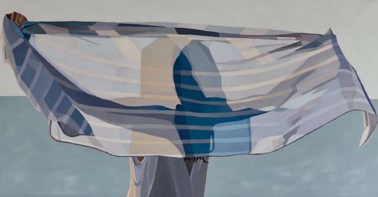 Silhouette of a woman holding fabric behind her head.